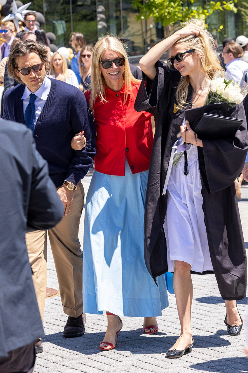 Gwyneth Paltrow wearing a red jacket over a sky blue dress with red high-heel sandals at Apple Martin's Vanderbilt University graduation