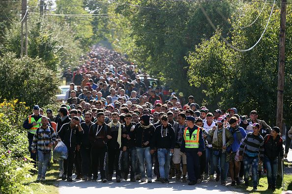 Hundreds of migrants at the Hungarian and Austrian border.