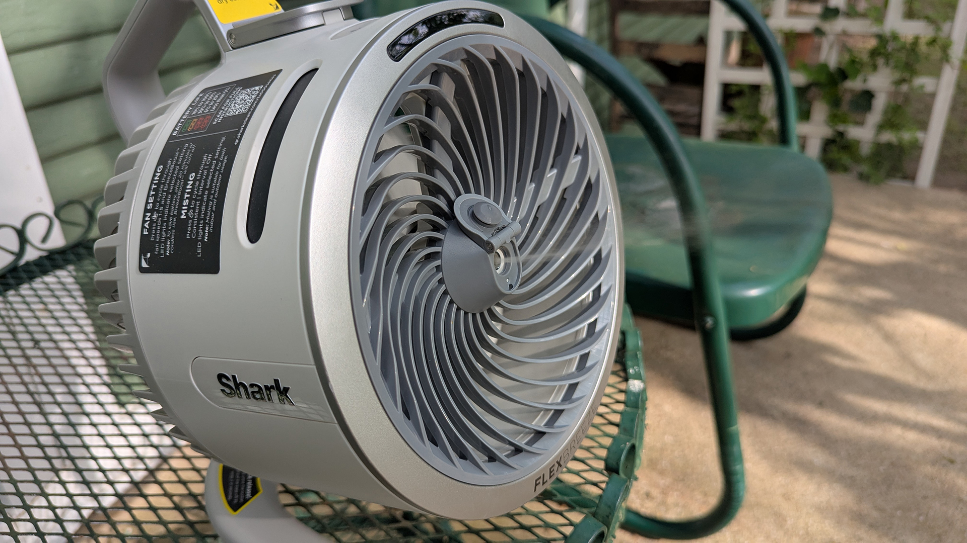 Shark FlexBreeze HydroGo portable fan in a garden