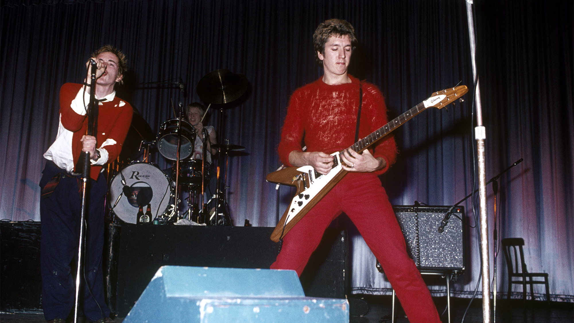 Photo of Steve JONES and Johnny ROTTEN and SEX PISTOLS; Johnny Rotten (John Lydon), Paul Cook &amp;amp; Steve Jones performing live onstage at Dunstable's Queensway Hall