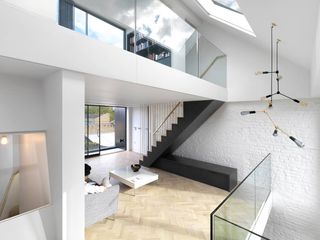 A series of staggered interior balconies allow for an influx of light in all the rooms