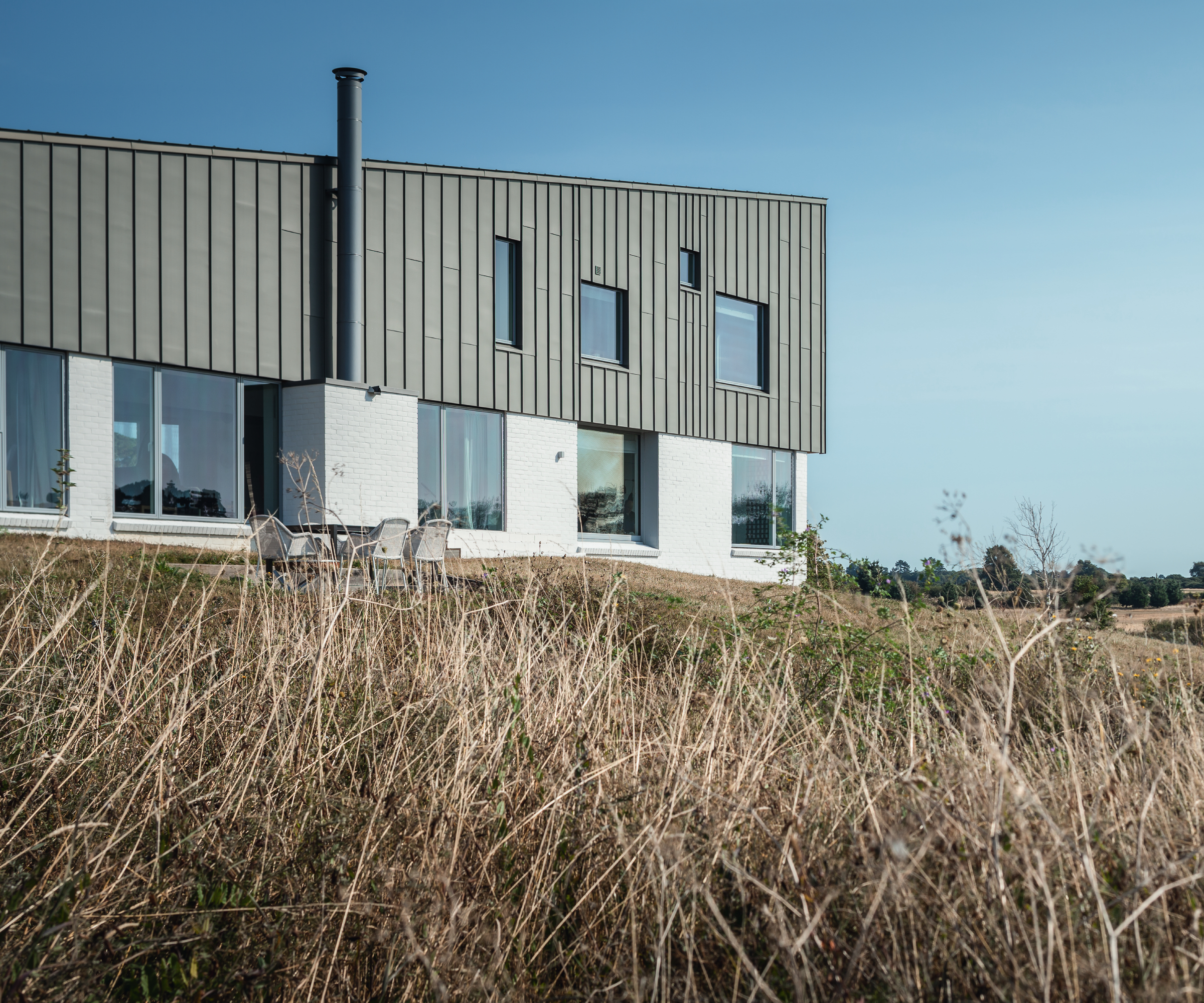 modern self build in rural location with wooden cladding and render