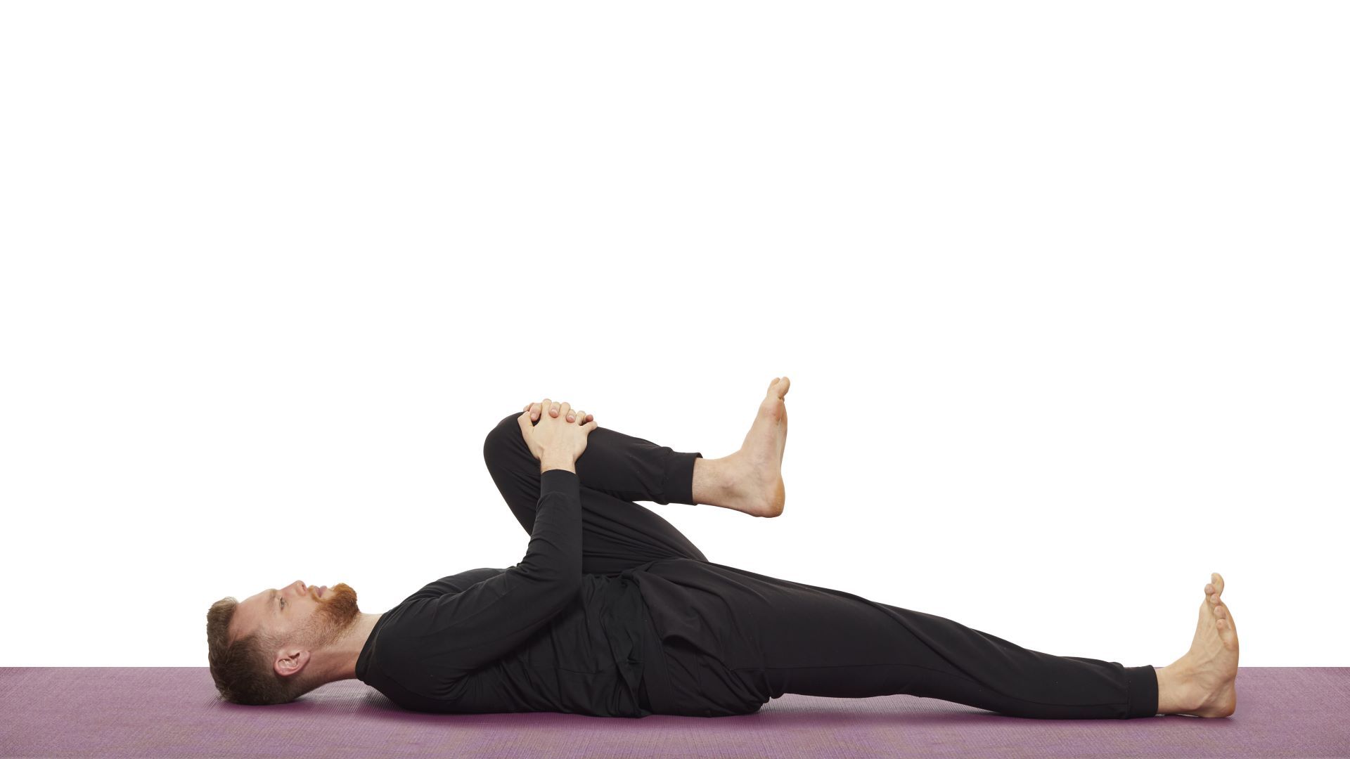 Yoga teacher Nick Higgins performs wind relieving pose