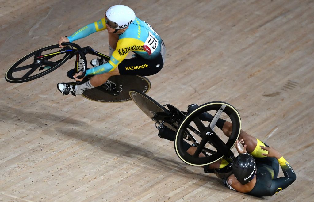 Kazakhstans Sergey Ponomaryov L crashes with Malaysias Muhammad Shah Firdaus Sahrom in the mens track cycling keirin first round heats during the Tokyo 2020 Olympic Games at Izu Velodrome in Izu Japan on August 7 2021 Photo by Greg Baker AFP Photo by GREG BAKERAFP via Getty Images