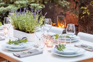 party table set with lavender and candles