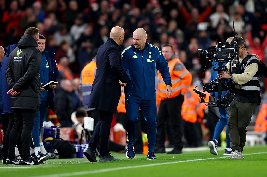 LIVERPOOL, ENGLAND - NOVEMBER 22: Arne Slot, Manager of Liverpool, and Sean Dyche, Manager of Nottingham Forest, interact following the Premier League match between Liverpool and Nottingham Forest at Anfield on November 22, 2025 in Liverpool, England. (Photo by Molly Darlington/Getty Images)
