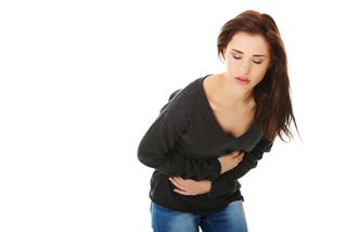 Woman with IBS cramps, irritable bowel syndrome