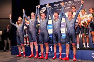 The Velocio-SRAM riders hold each others hands aloft on the podium