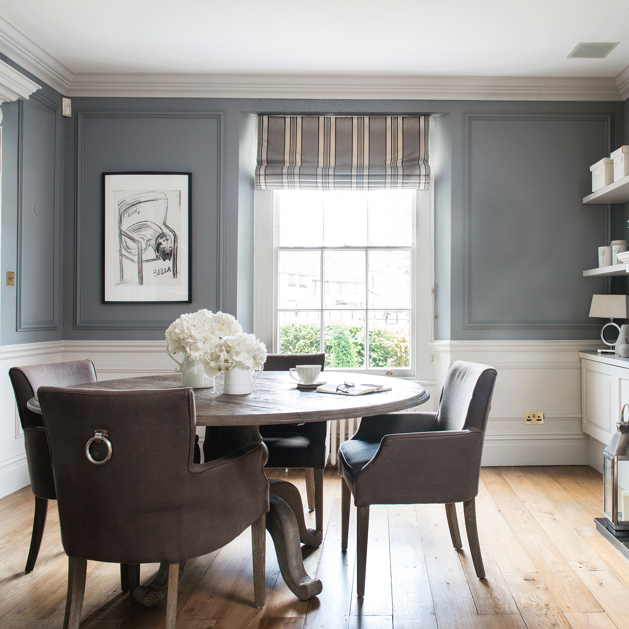 Grey dining room with table and painting