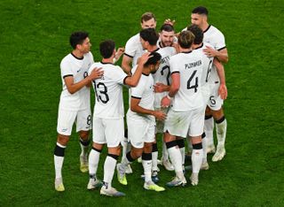 New Zealand players celebrate a goal in a friendly against the Republic of Ireland in November 2023.