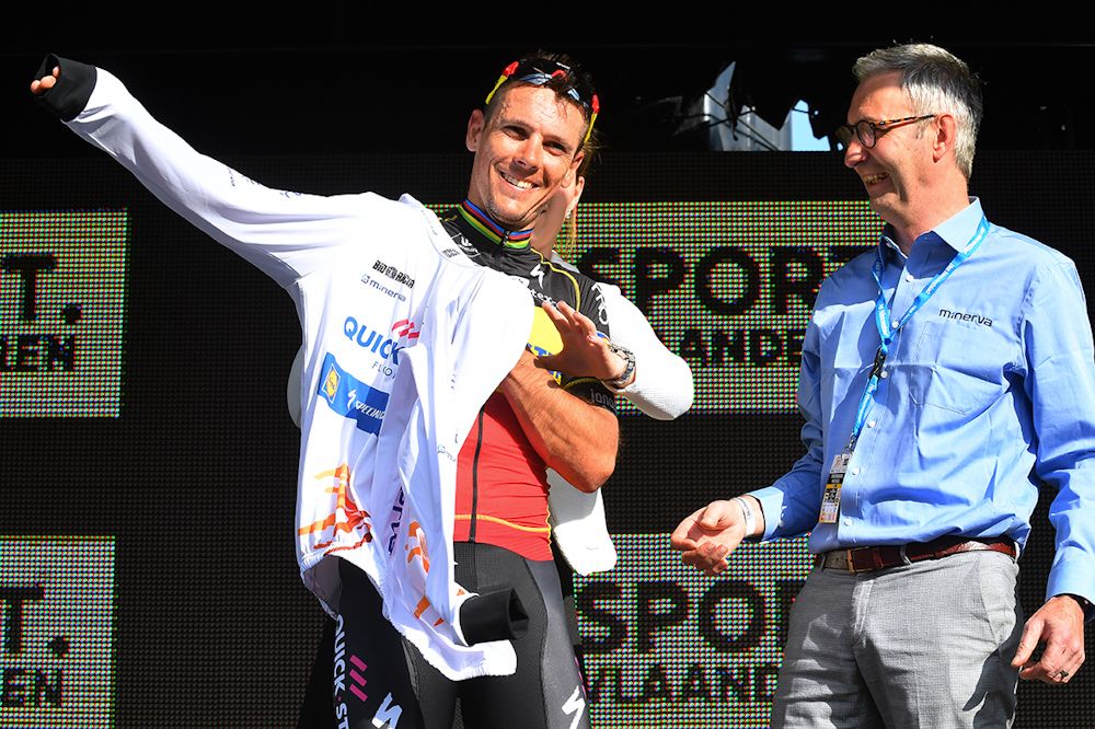 Philippe Gilbert on the podium after winning stage 1 at Three Days of De Panne