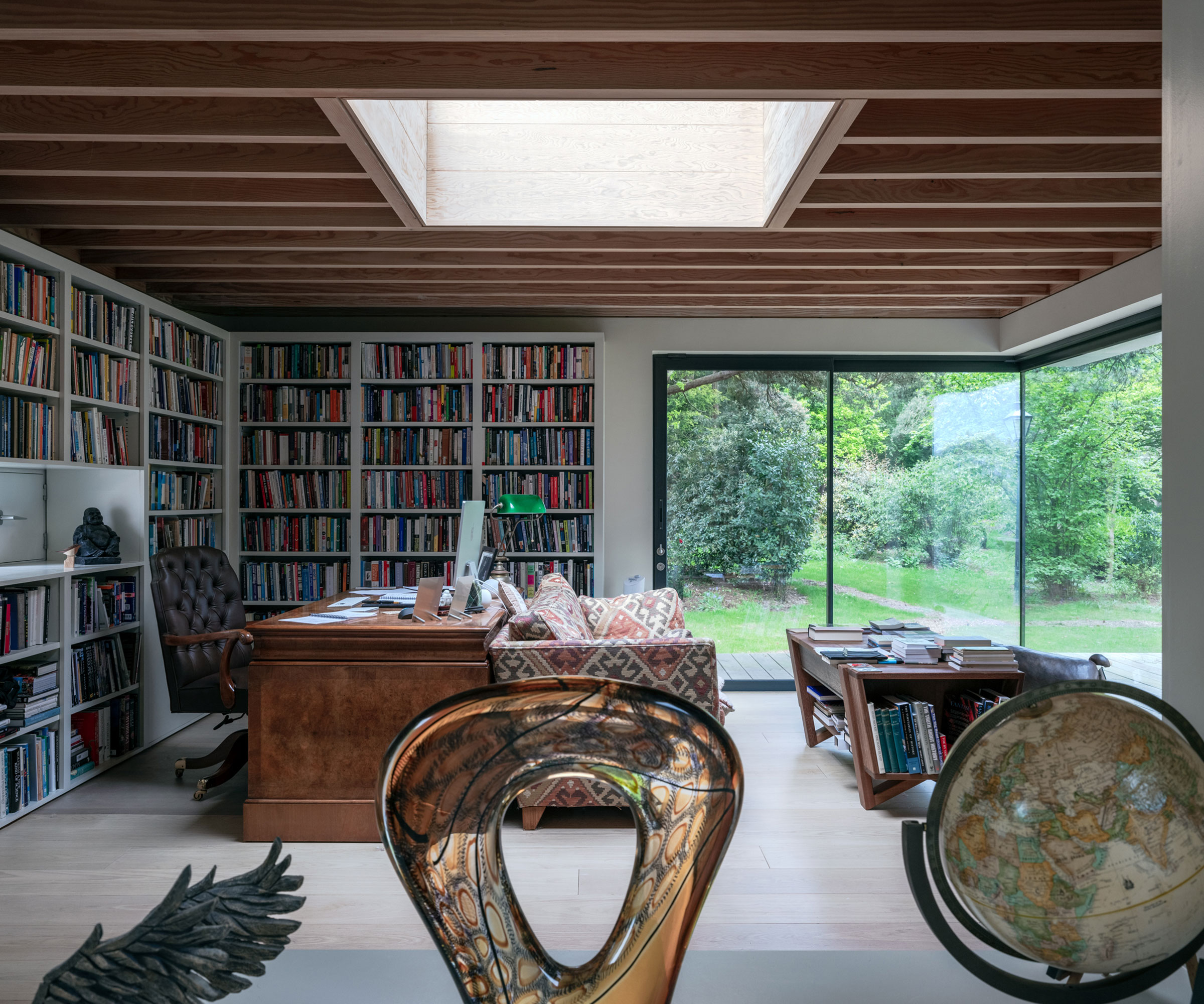 home office with roof lantern and slimline sliding doors