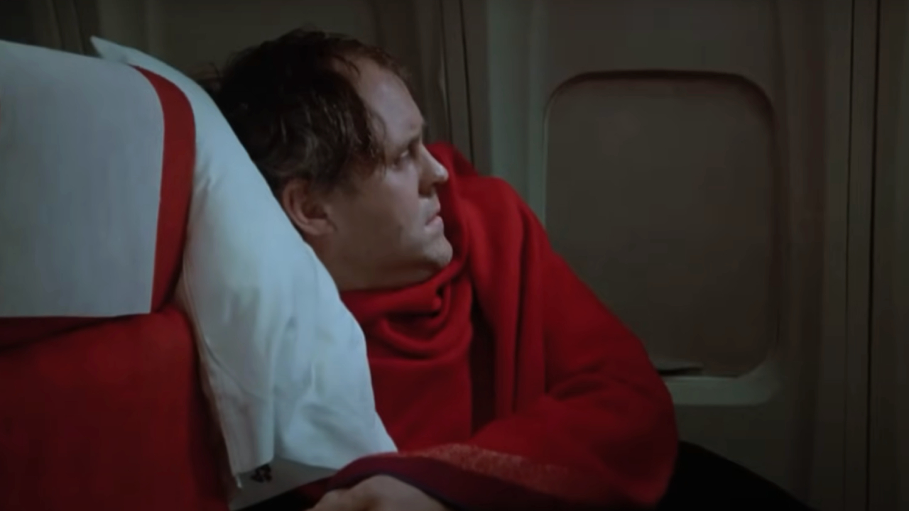 John Lithgow looking at his plane window in Twilight Zone: The Movie