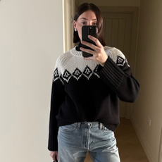 woman wearing boots tucked into jeans trend fall 2025