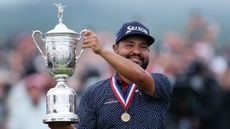 JJ Spaun holding the US Open trophy