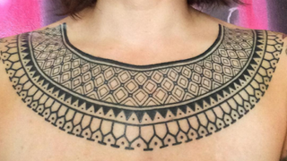 Tribal collar tattoo
