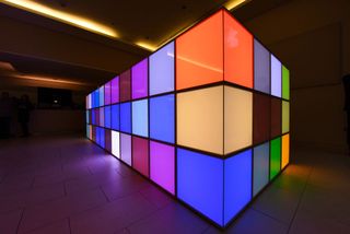 sculpture of flashing pixel boxes