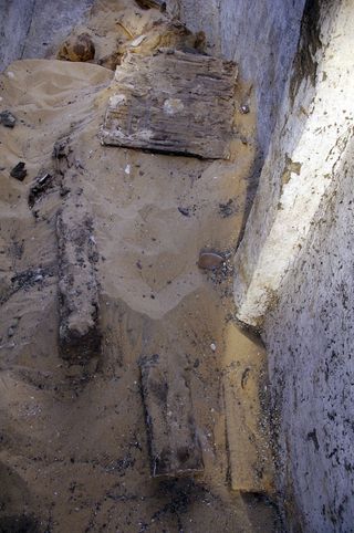 pile of remains and sand in tomb