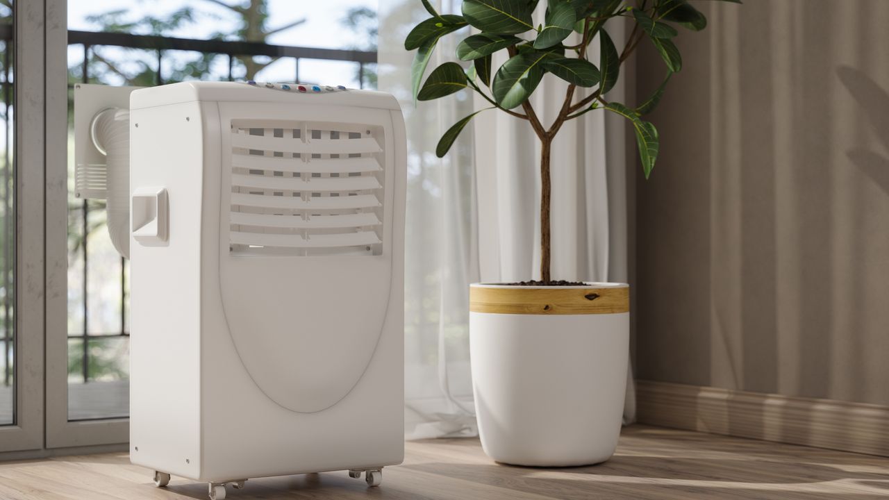 A dehumidifier next to a plan