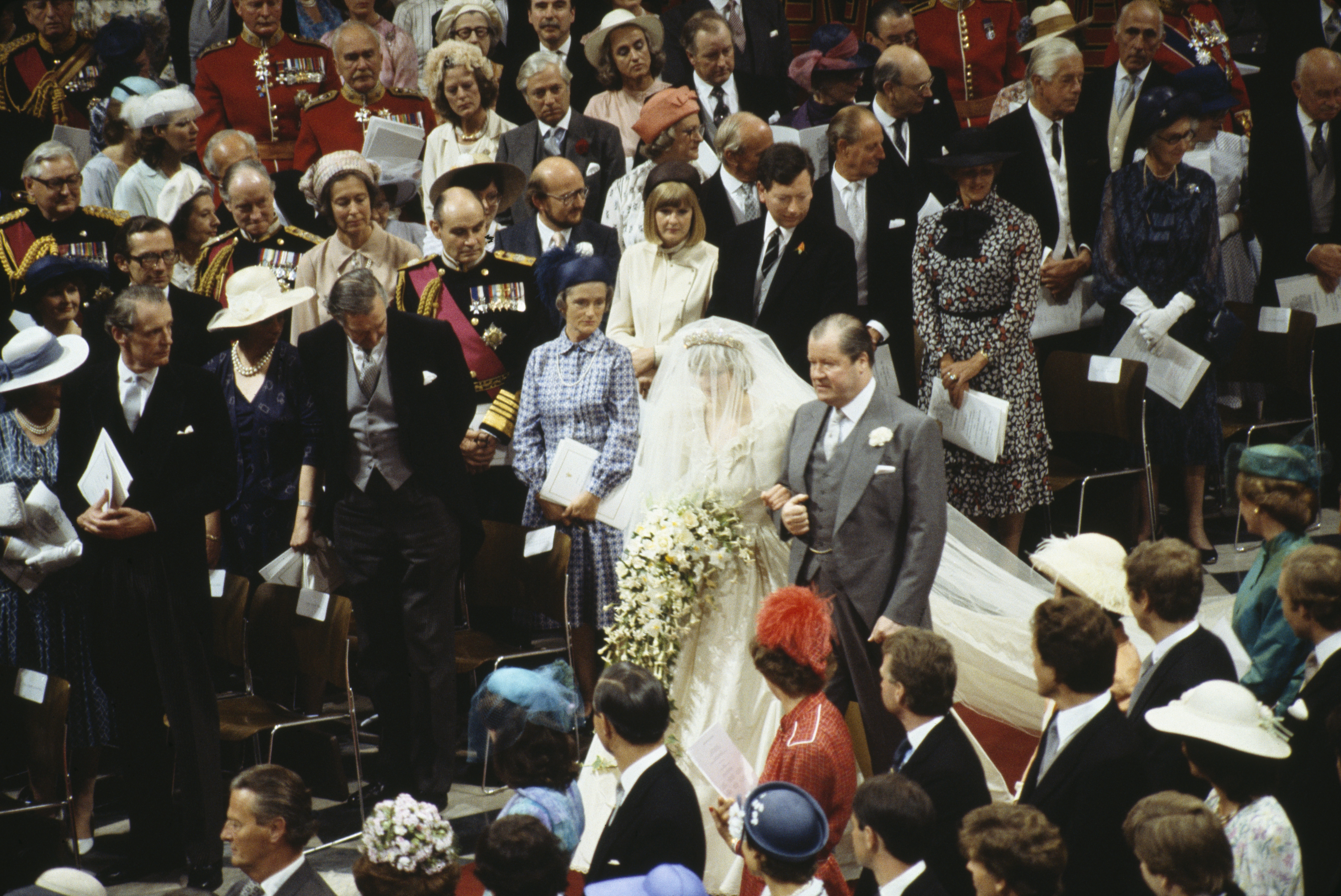 Princess Diana walking on her father's arm on her wedding day