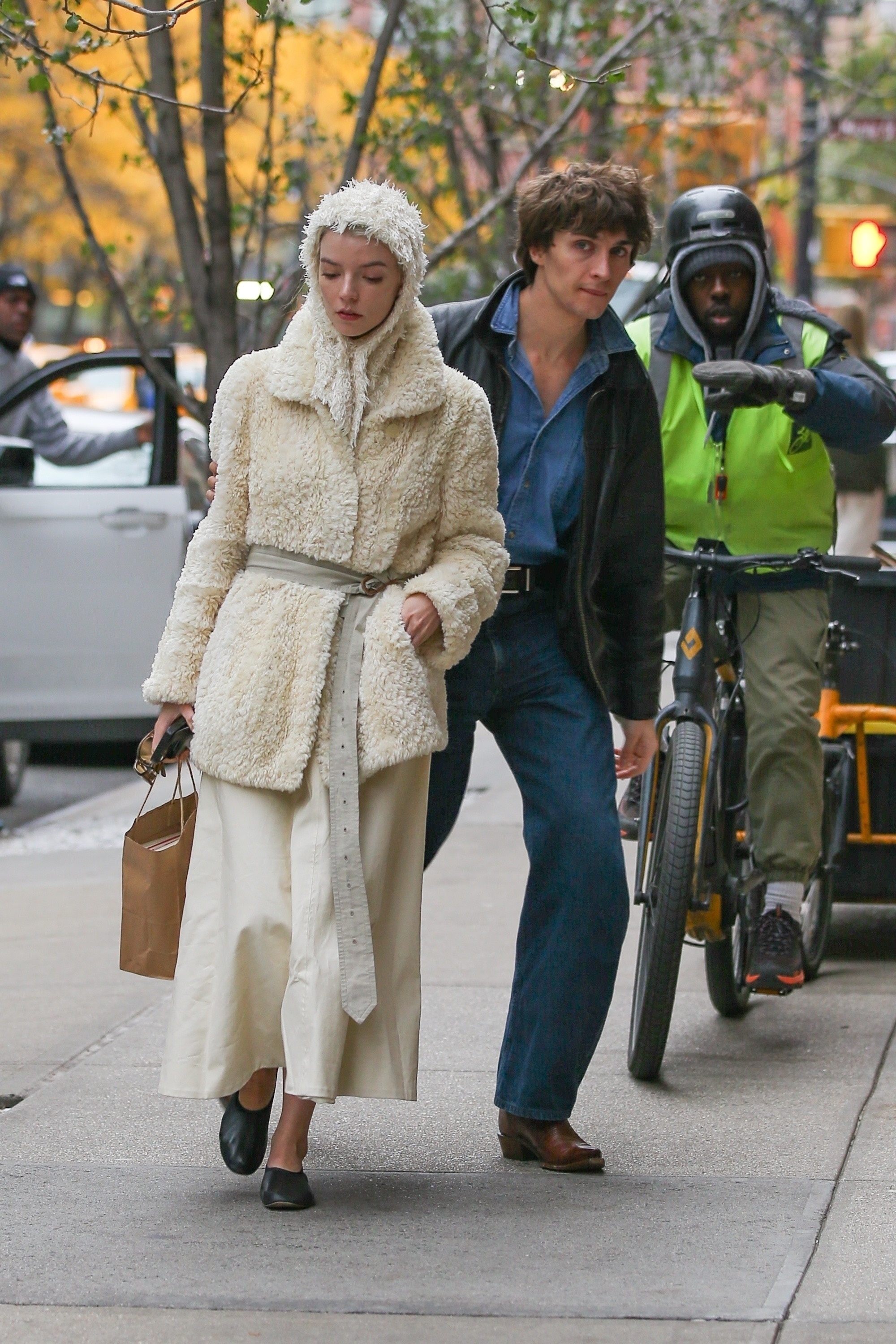 Anya Taylor-Joy wore ballet flats with a sherpa coat and a matching head scarf