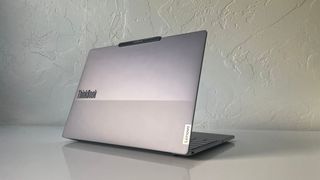 The Lenovo ThinkBook 13x G4 seen from behind on a white table