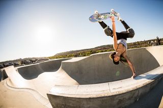 skateboarder Lizzie Armanto mid move while skateboarding