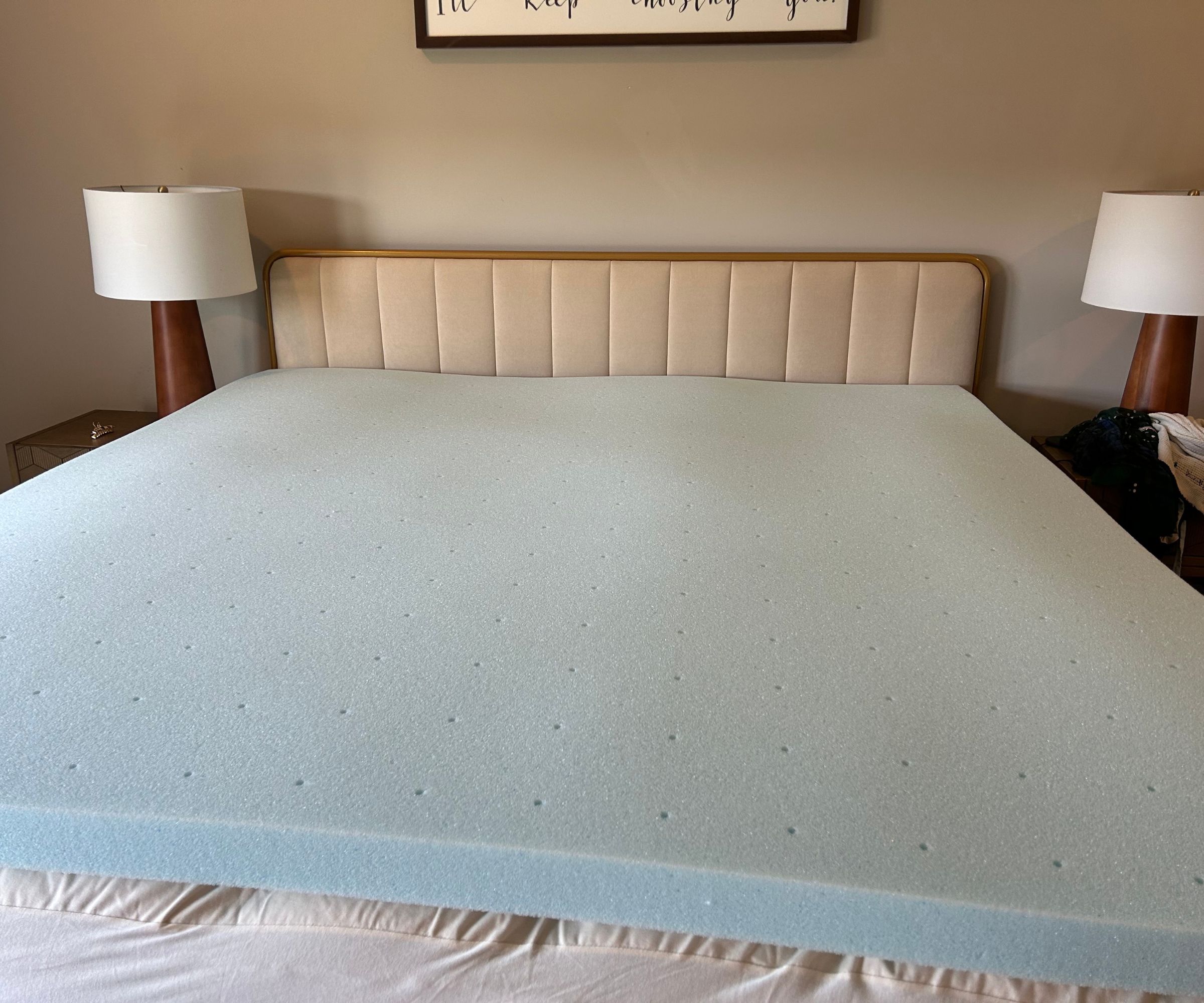Lucid gel memory foam mattress topper on a bed