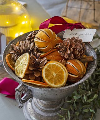 Festive potpourri with pinecones and oranges