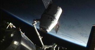 SpaceX's Dragon space capsule is detached from its docking port on the International Space Station on May 31, 2012 ahead of the spacecraft's return to Earth to end its first voyage to the orbiting lab.