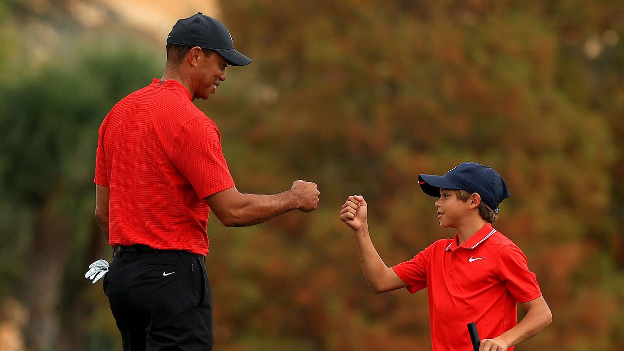 Tiger and Charlie Woods fist bump