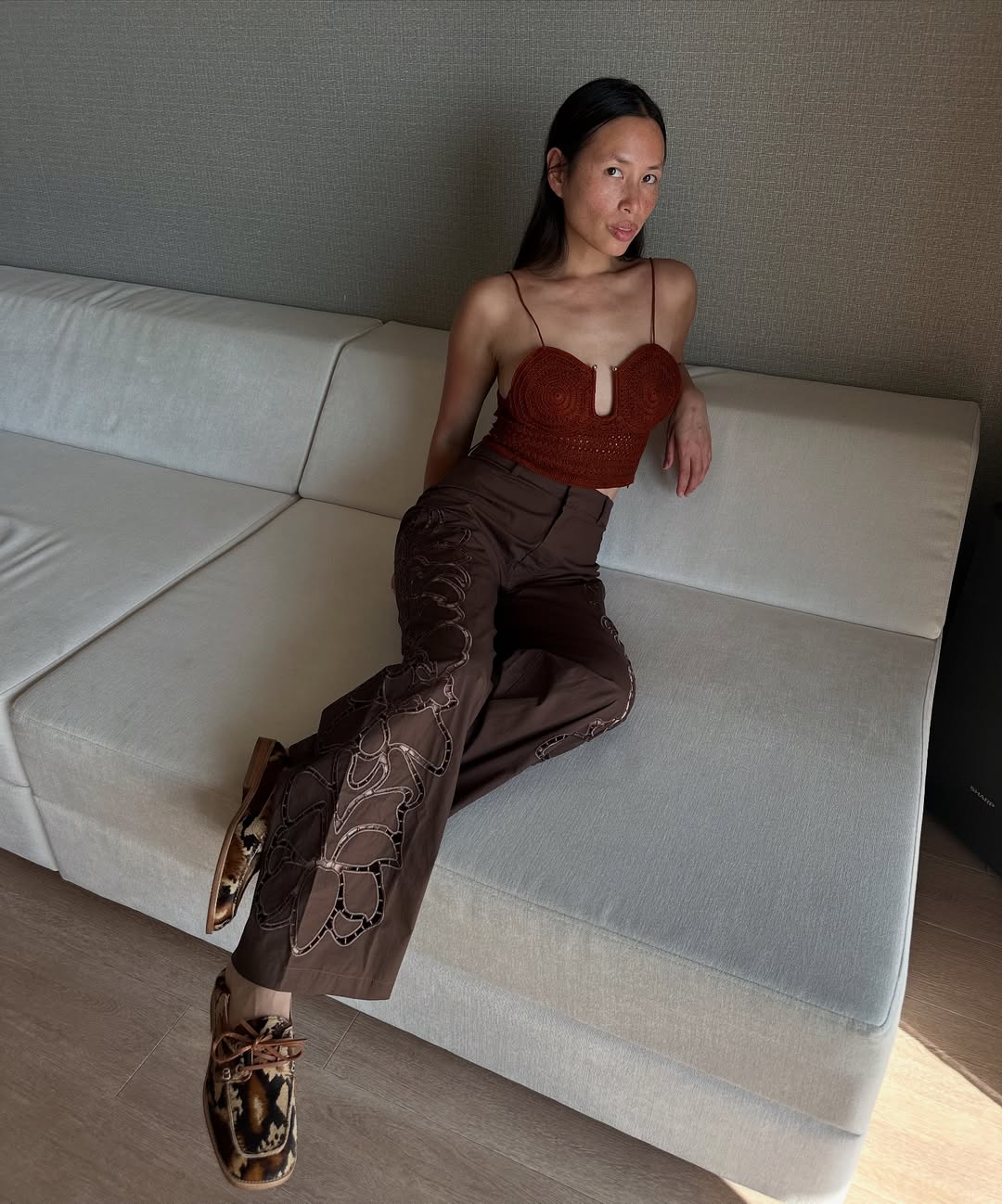 Anne-Victoire in brown cut-out trousers