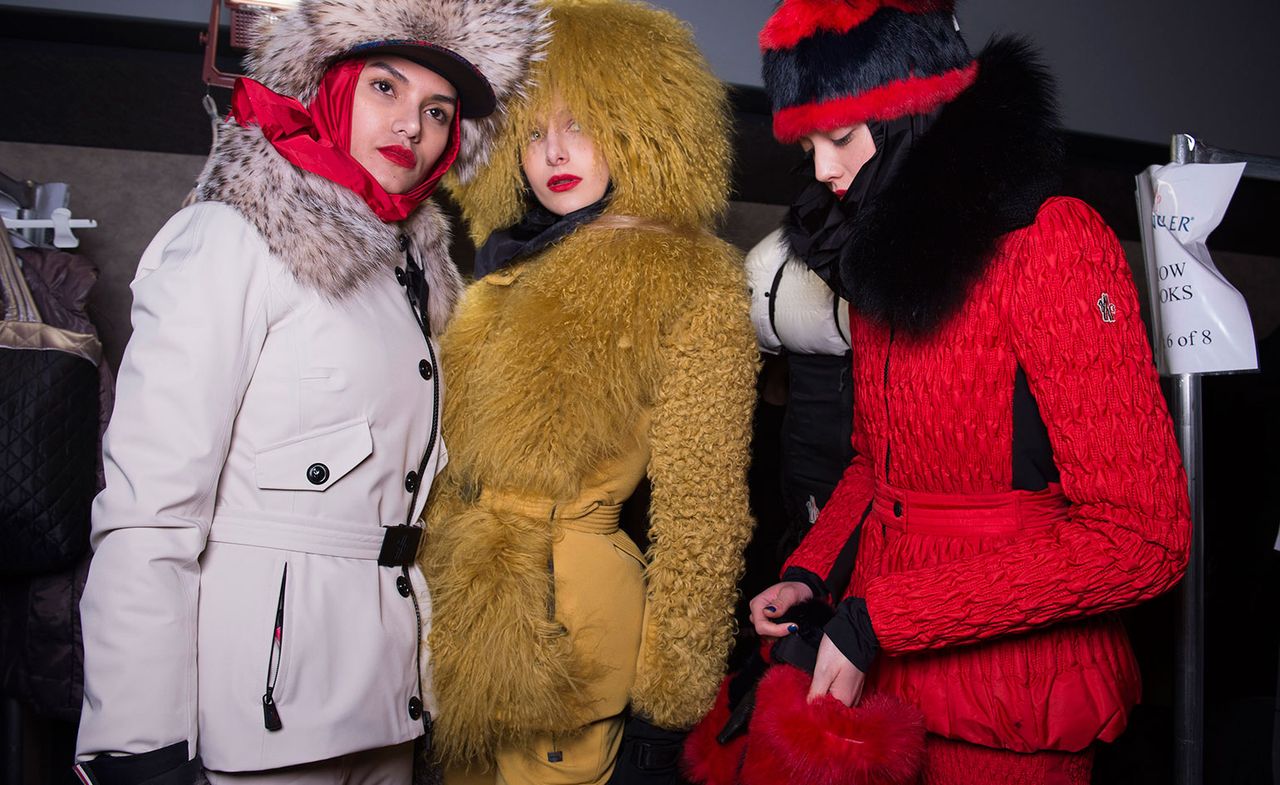 Three models, one in a white coat, one in a caramel coat and one in a red coat