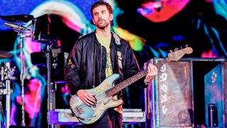 Guy Berryman of Coldplay performs at Stadio San Siro, on June 25, 2023 in Milan, Italy