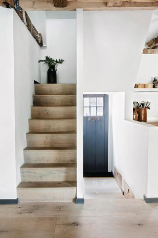 Hallway shoe storage ideas with slide out drawers in wood stairs