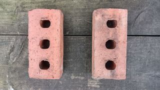 Two house bricks resting on sleepers