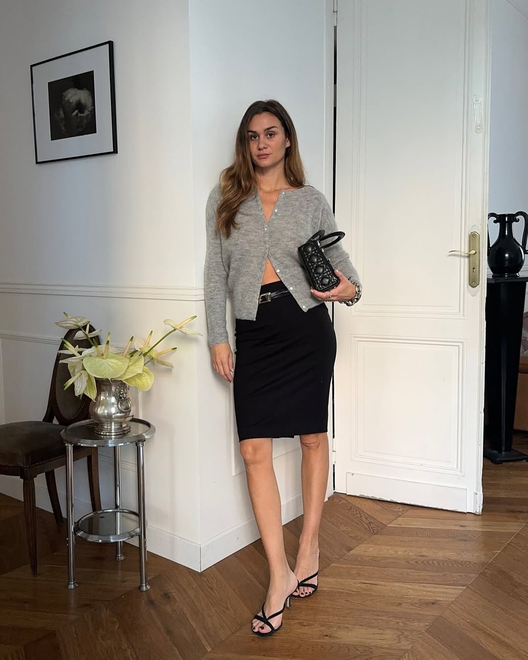 Adenorah wears heeled sandals