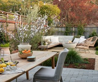 backyard with dining table and fire pit