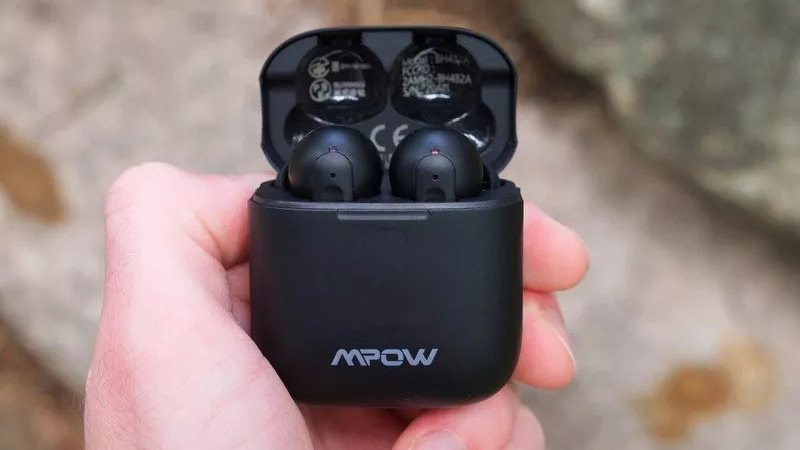 Mpow X3 earbuds in case in hand.
