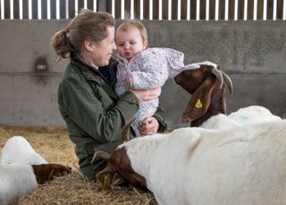 Laura Corbett, goat farmer, Wiltshire. She is pictured here two of her rare breed White Park cattle. Photograph: Millie Pilkington/Country Life Picture Library OVERS