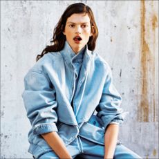 seated woman wearing denim