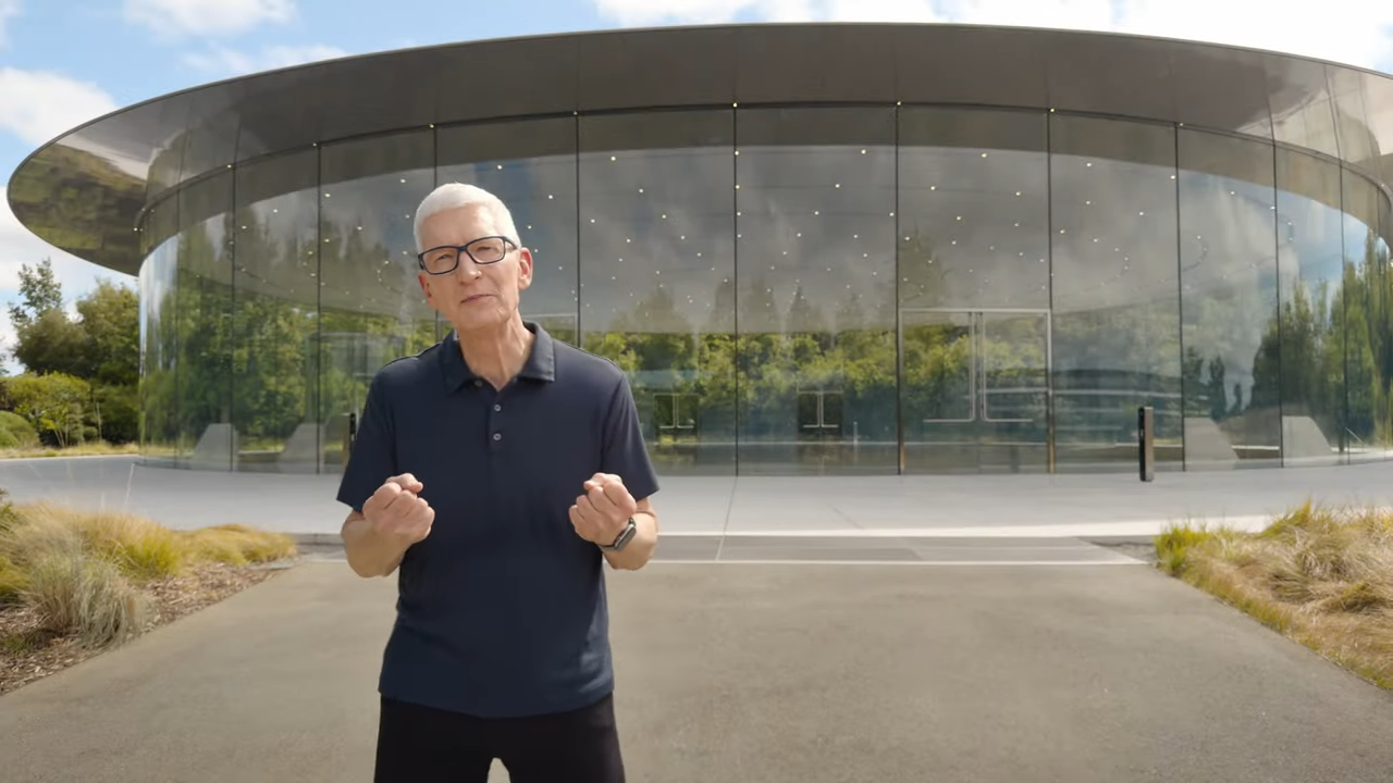Tim Cook close-up in front of Apple HQ