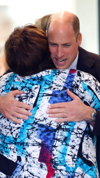 Prince William hugging someone