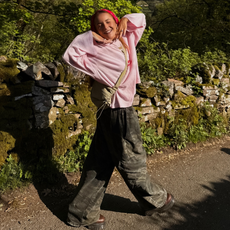 Influencer Rebecca Ferraz Wyatt wearing a long sleeve t-shirt, camo jeans and headscarf. 