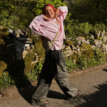 Influencer Rebecca Ferraz Wyatt wearing a long sleeve t-shirt, camo jeans and headscarf. 