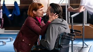 MYANNA BURING as Melinda Ricci kissing EMMETT J SCANLAN as Patrick who is in a wheelchair