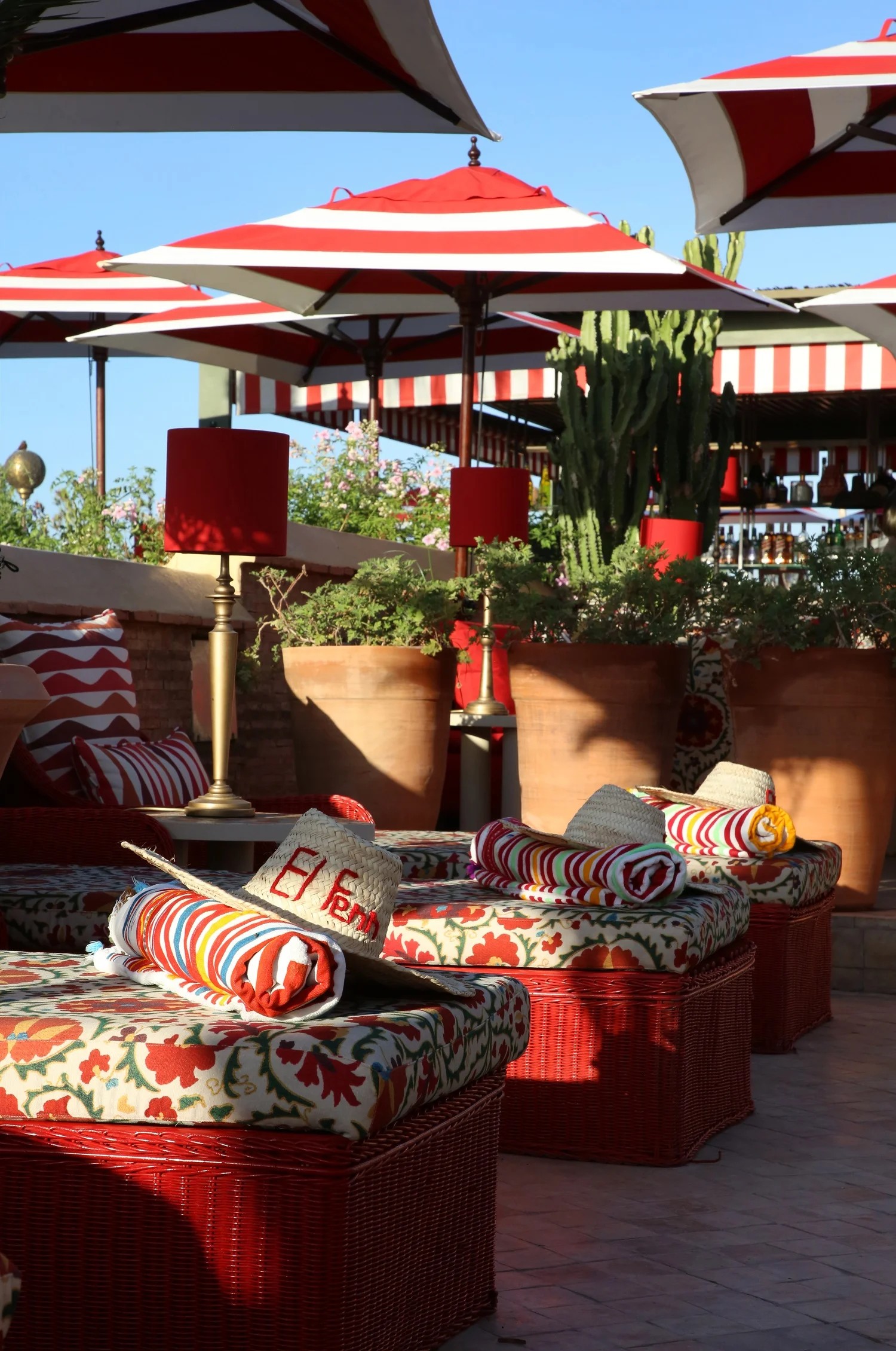 A colorful Moroccan riad has been transformed into a kaleidoscope of patterned textiles, striking artwork, and eye-catching tiles.