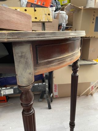 Sanded side of half moon console table