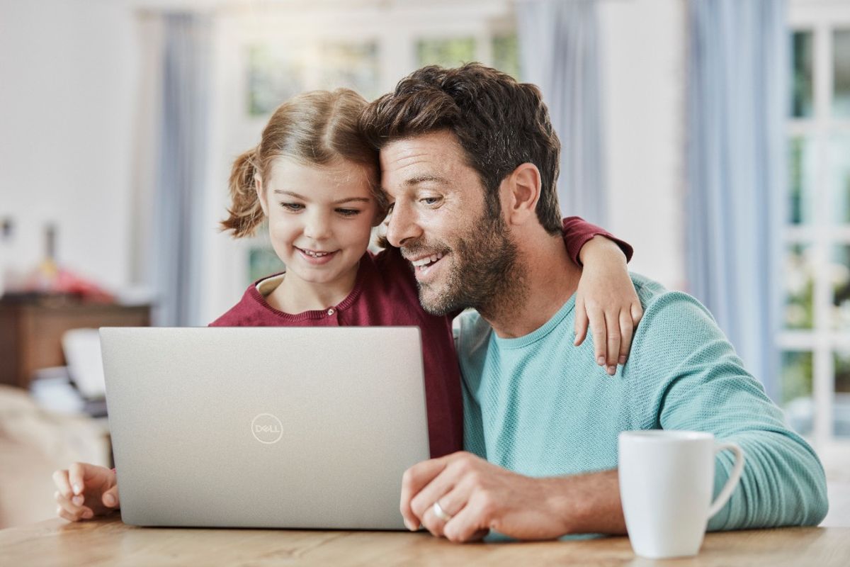 A Dell laptop being used. 