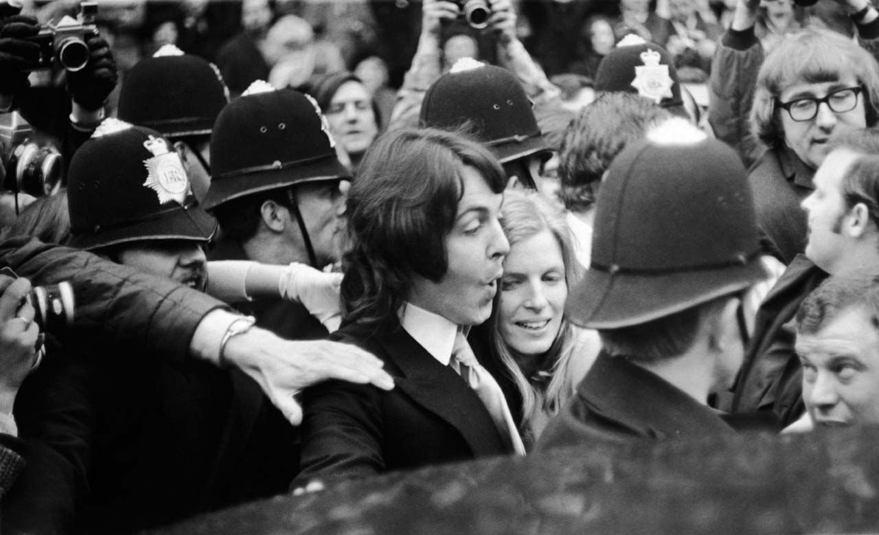 Paul and Linda McCartney leave Marylebone Registry Office with a police escort after their civil wedding ceremony.